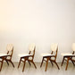 Vier vintage design eetkamerstoelen van Pynock Wierden uit de jaren 50 in Nederland. Gemaakt van teakhout en voorzien van nieuwe gebroken witte stoffen bekleding. Zeer goede vintage staat., Four vintage design dining chairs from Pynock Wierden in the 1950s Netherlands. Made of teak wood and featuring new broken white fabric upholstery. In very good vintage condition.